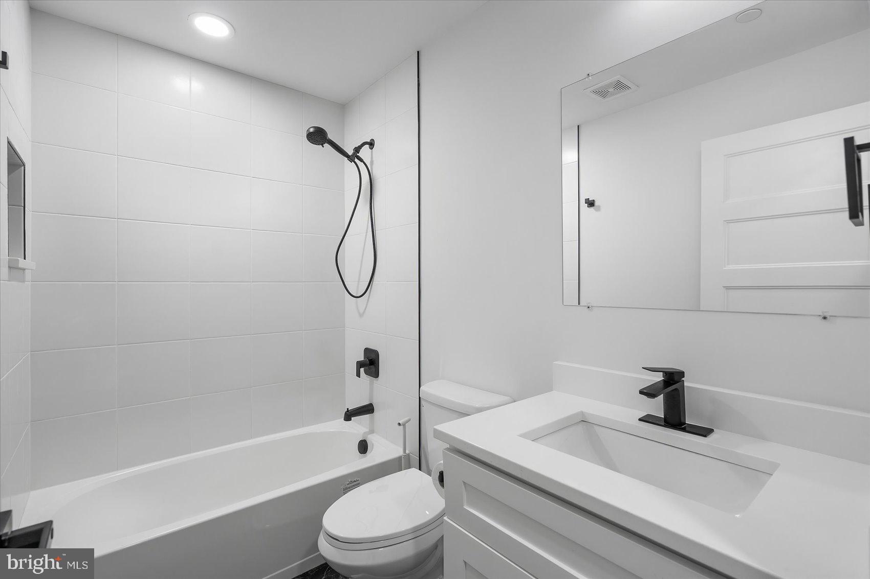 11030 Bird River Grove Road White Marsh, MD 21162 - Photo 47 of 53 a bathroom with a sink a toilet and a bathtub