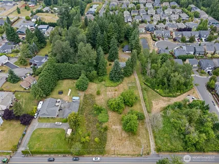 a view of yard with swimming pool and green space