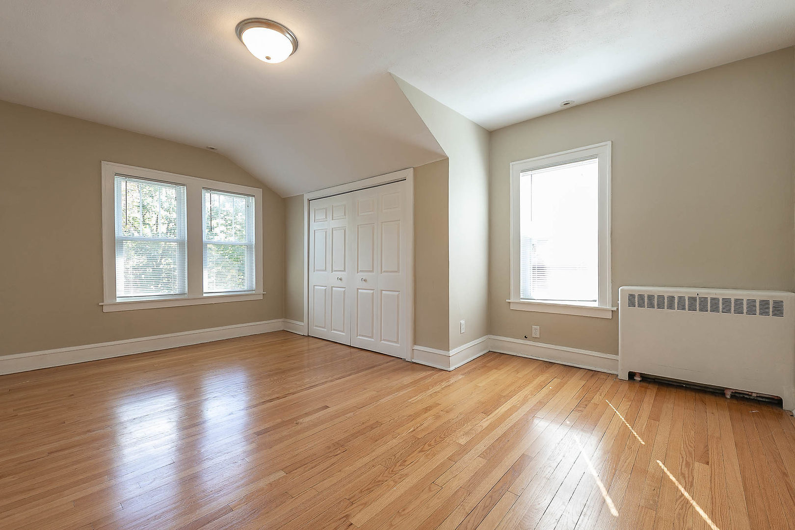 452 Loudon Road Riverside, IL 60546 - Photo 11 of 28 an empty room with wooden floor and windows