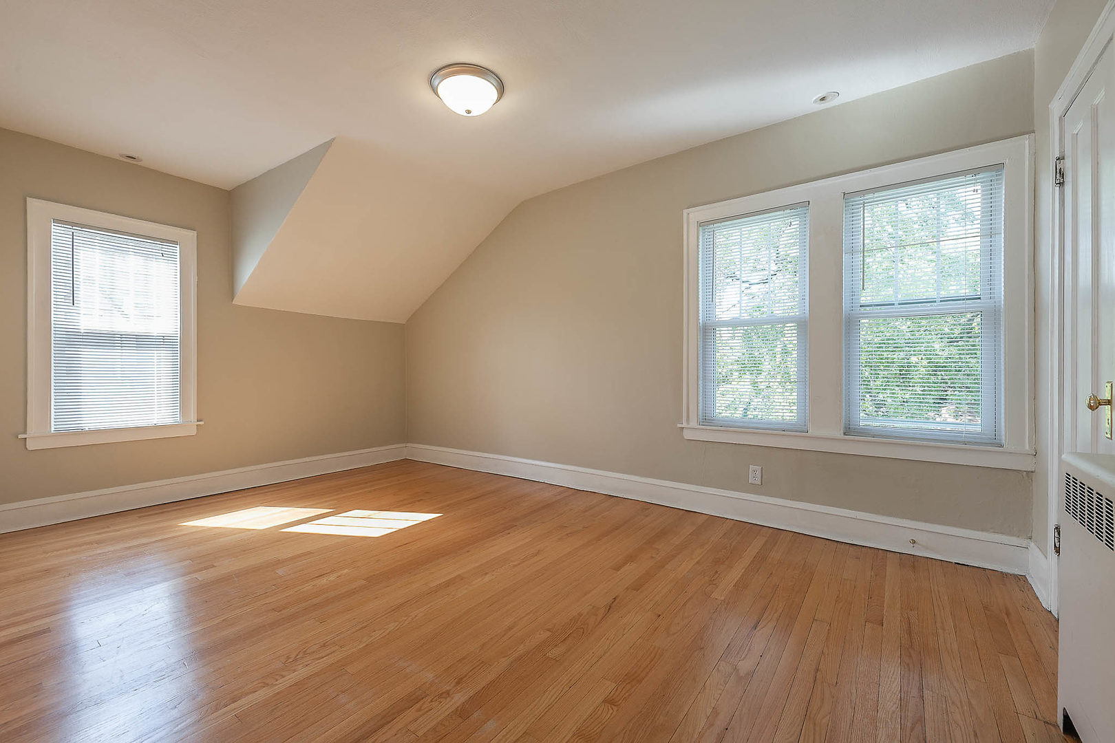 452 Loudon Road Riverside, IL 60546 - Photo 12 of 28 a view of an empty room with wooden floor and a window