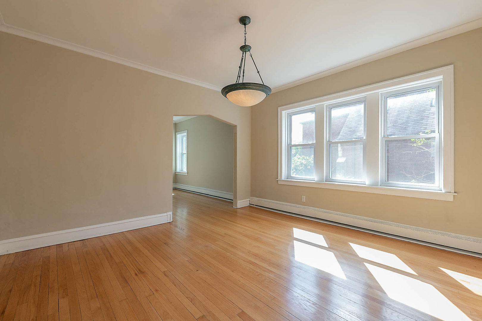 452 Loudon Road Riverside, IL 60546 - Photo 14 of 28 a view of an empty room with wooden floor and a window
