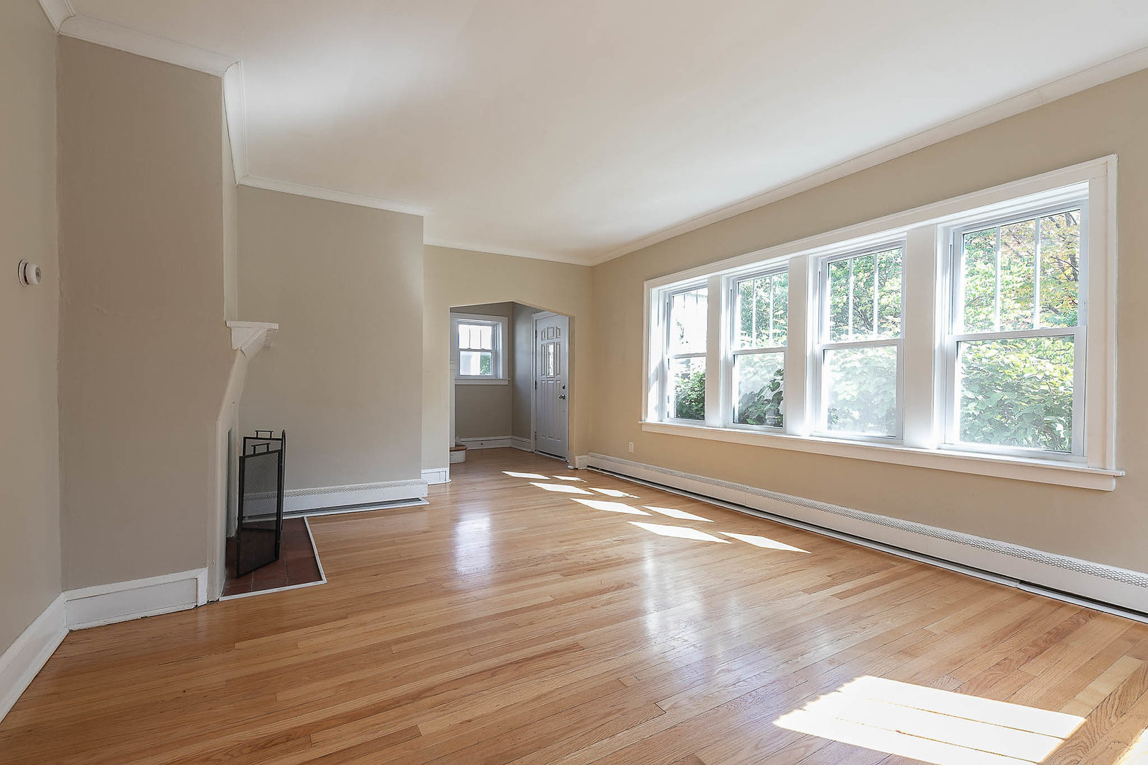 452 Loudon Road Riverside, IL 60546 - Photo 15 of 28 a view of an empty room with wooden floor and a window