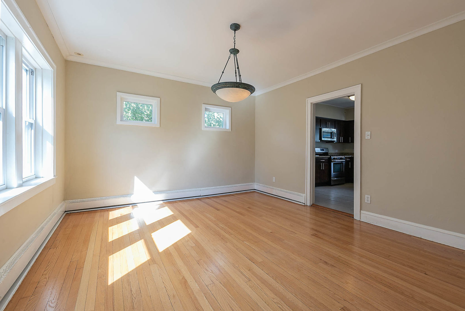 452 Loudon Road Riverside, IL 60546 - Photo 16 of 28 wooden floor in an empty room with a window
