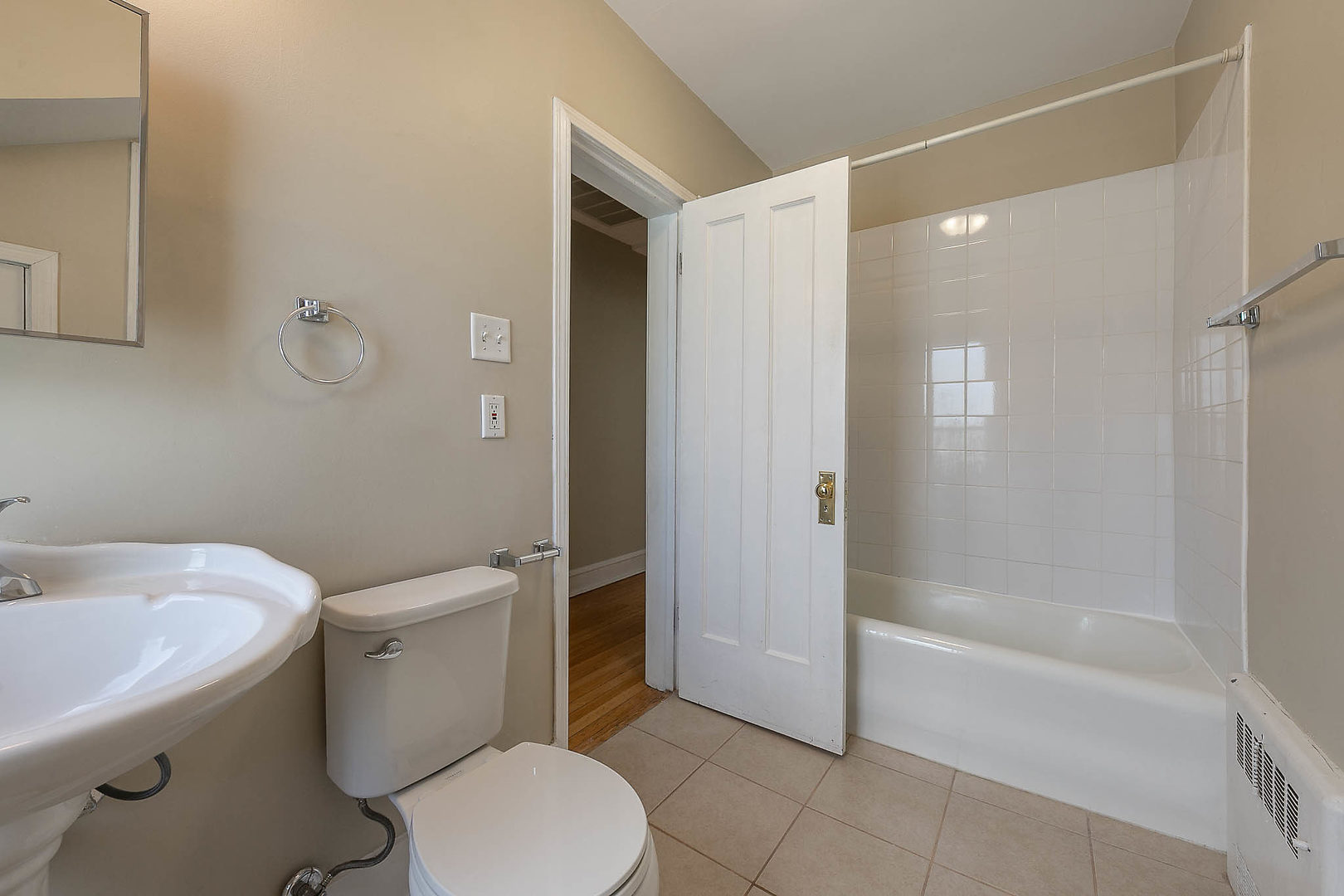 452 Loudon Road Riverside, IL 60546 - Photo 18 of 28 a white toilet sitting next to a bath tub