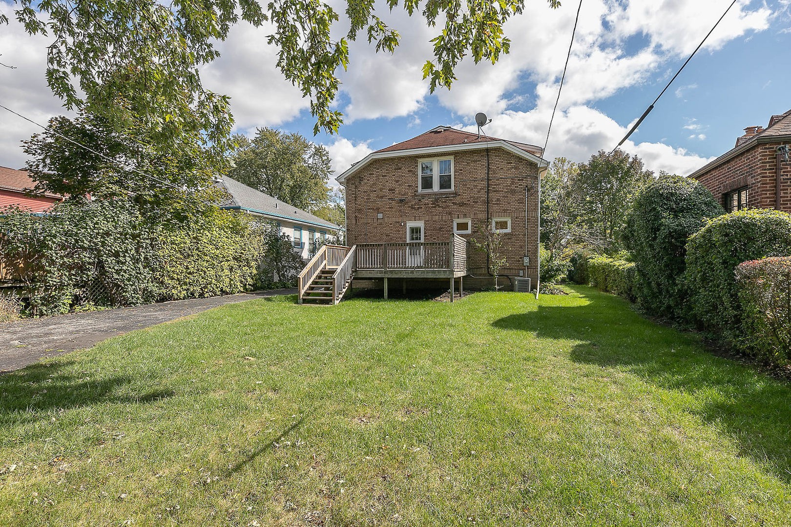 452 Loudon Road Riverside, IL 60546 - Photo 25 of 28 a view of a big house with a big yard and large trees