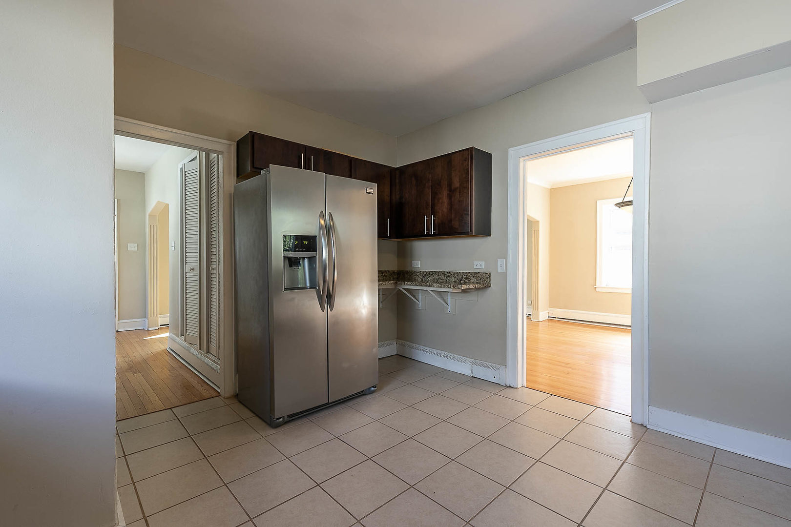 452 Loudon Road Riverside, IL 60546 - Photo 4 of 28 a kitchen with stainless steel appliances a refrigerator and a sink