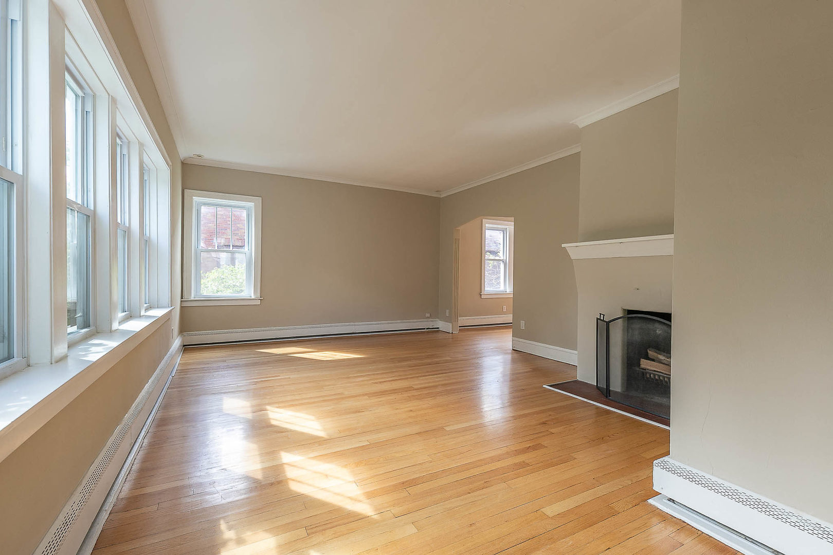 452 Loudon Road Riverside, IL 60546 - Photo 8 of 28 a view of an empty room with a window and wooden floor
