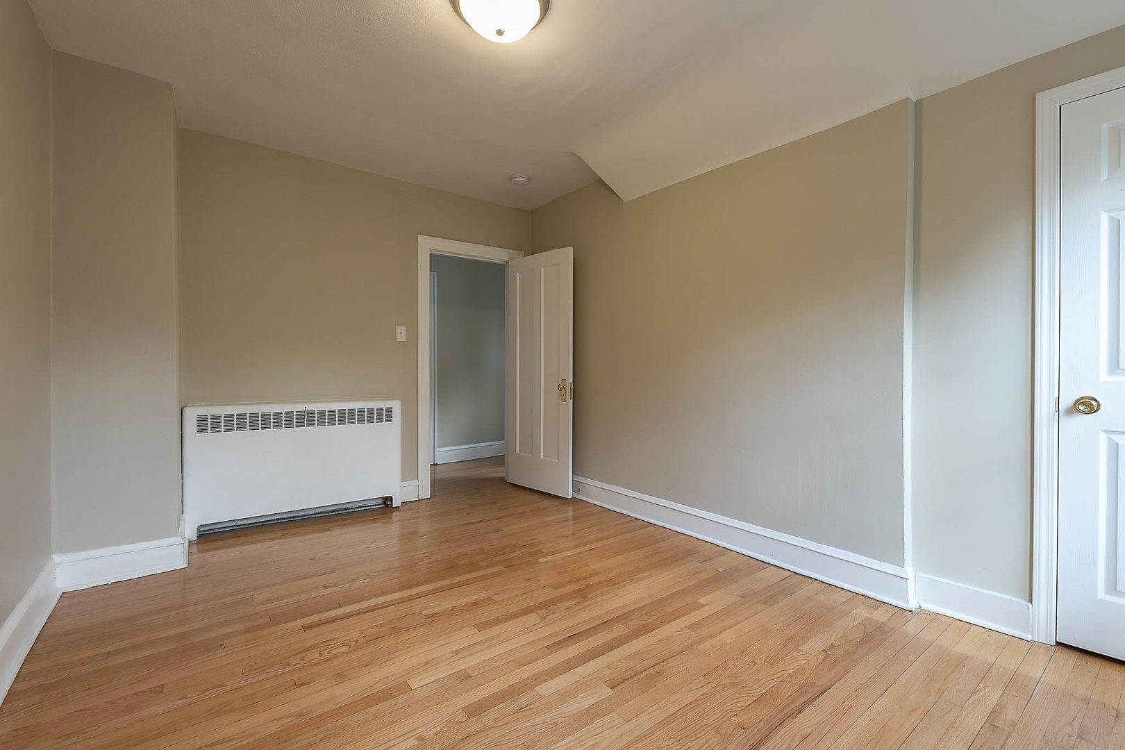 452 Loudon Road Riverside, IL 60546 - Photo 9 of 28 an empty room with wooden floor