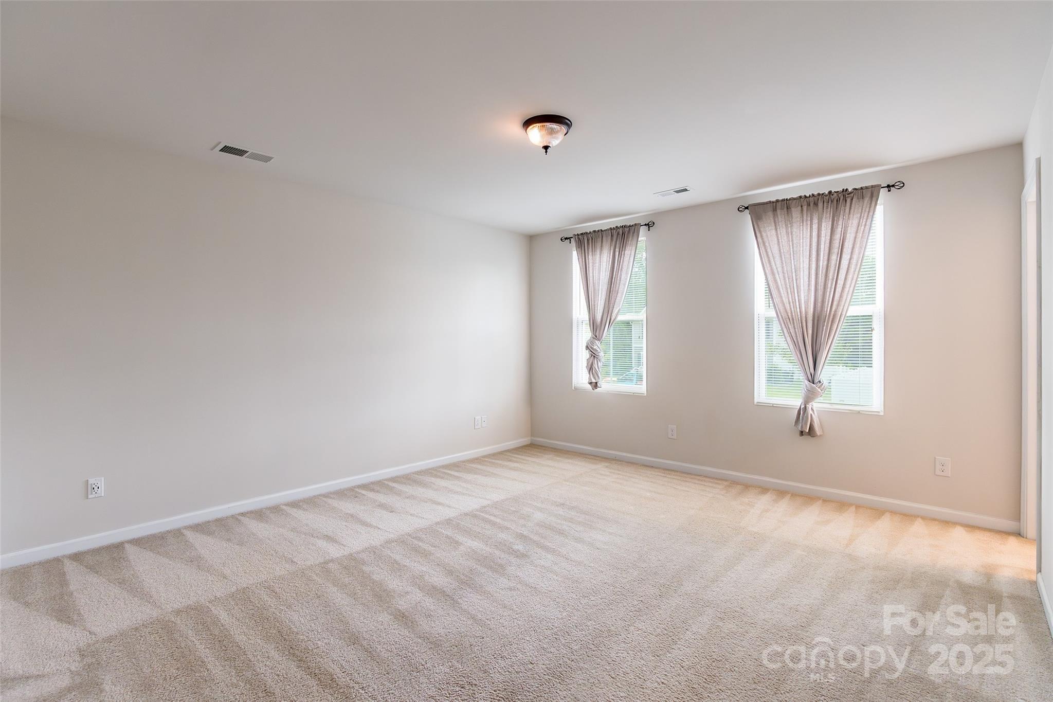 1128 Tangle Ridge Drive Southeast Concord, NC 28025 - Photo 13 of 27 a view of an empty room with a window