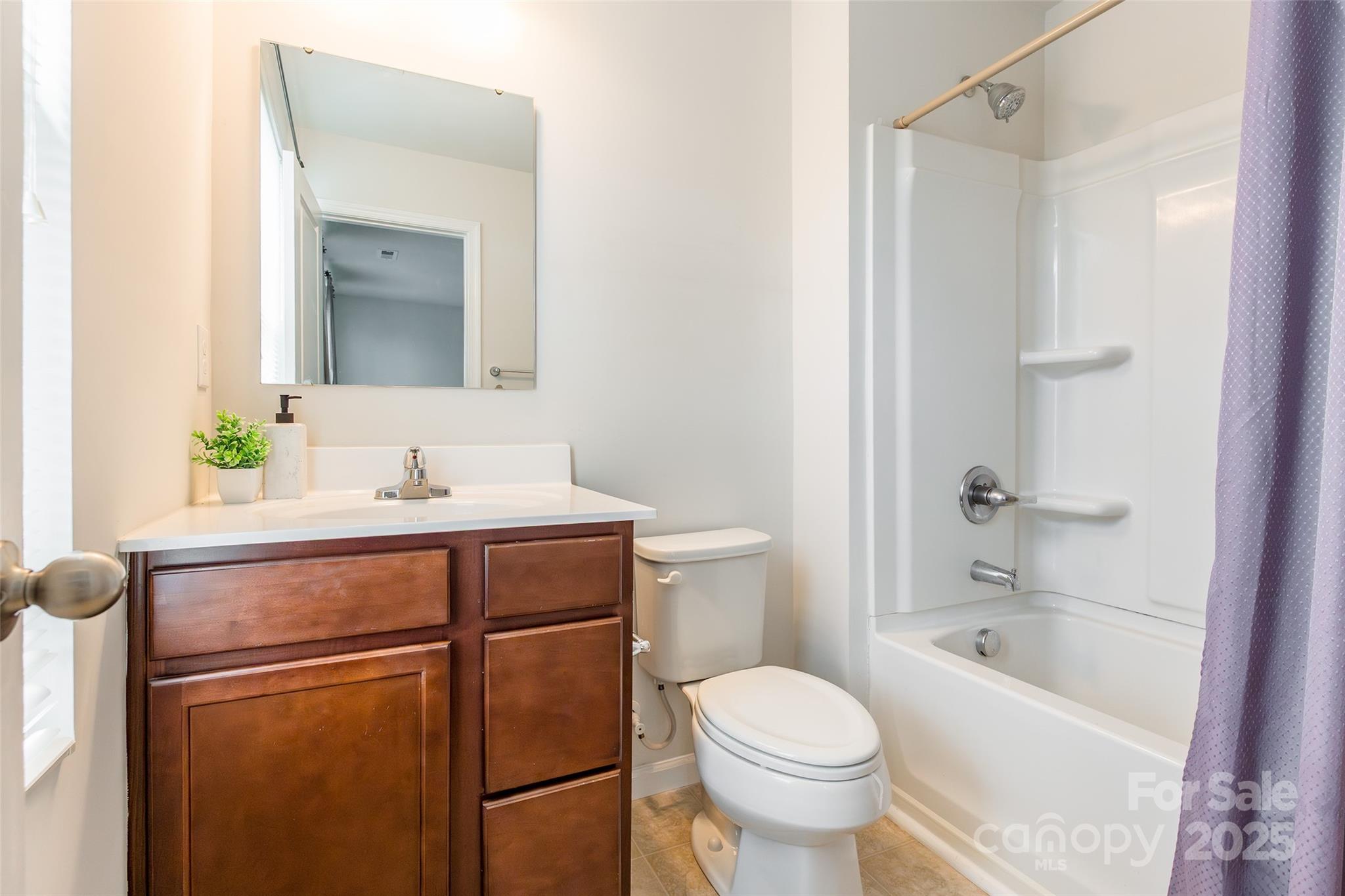 1128 Tangle Ridge Drive Southeast Concord, NC 28025 - Photo 16 of 27 a bathroom with a sink toilet and shower