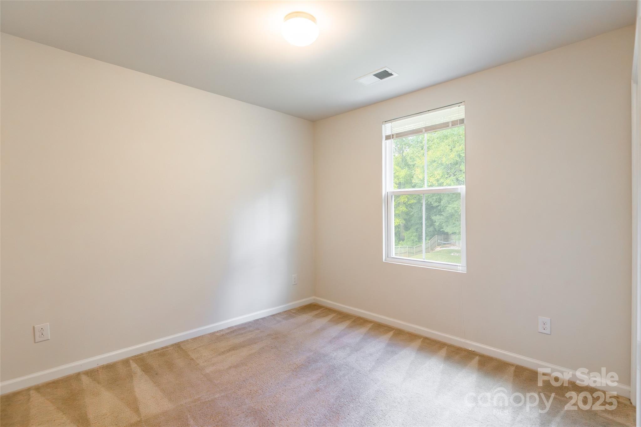1128 Tangle Ridge Drive Southeast Concord, NC 28025 - Photo 17 of 27 an empty room with a window