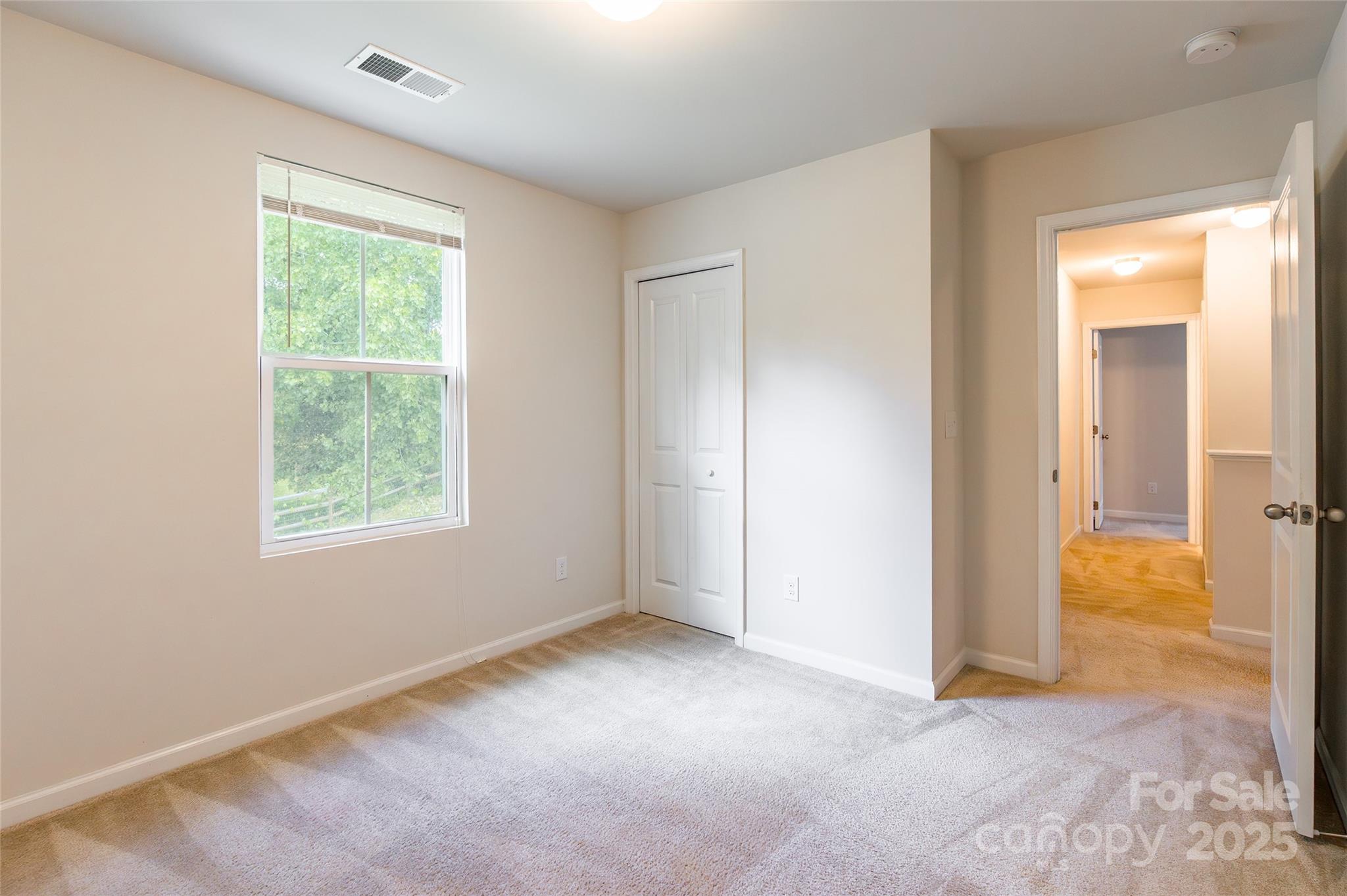 1128 Tangle Ridge Drive Southeast Concord, NC 28025 - Photo 18 of 27 an empty room with windows and closet