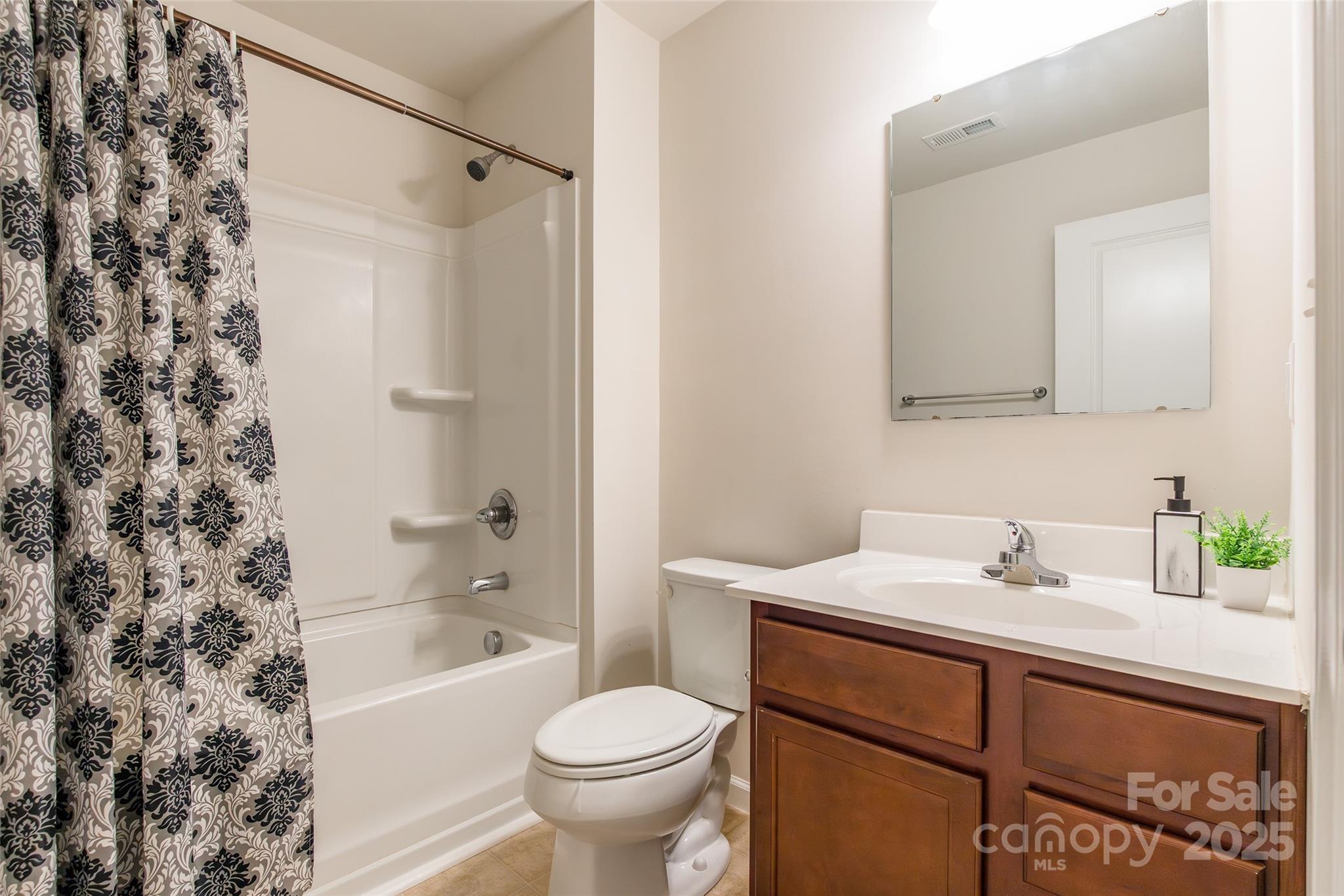 1128 Tangle Ridge Drive Southeast Concord, NC 28025 - Photo 19 of 27 a bathroom with a sink toilet and shower