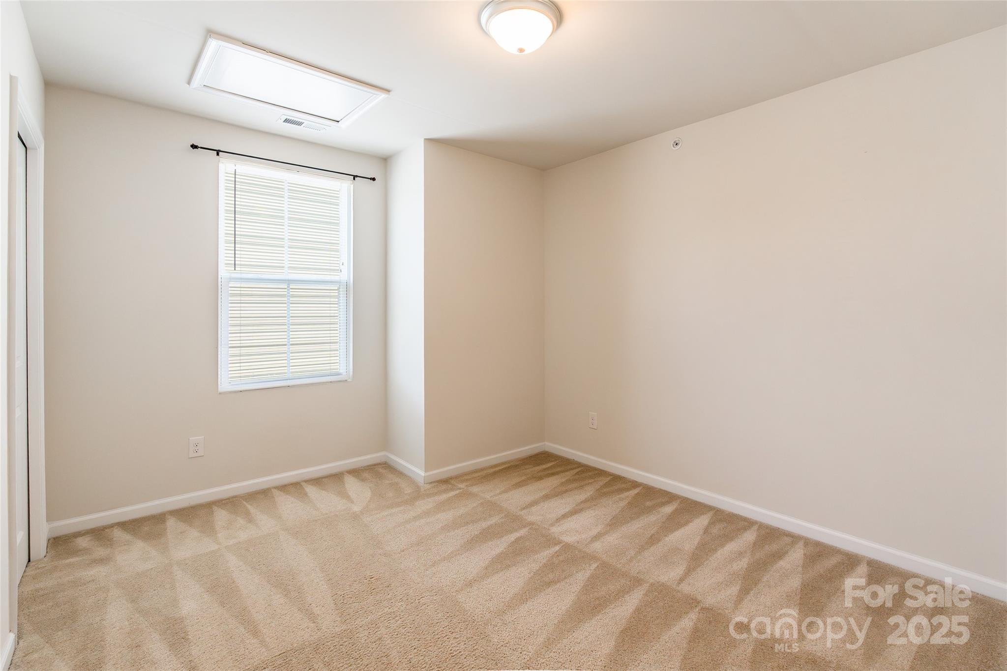 1128 Tangle Ridge Drive Southeast Concord, NC 28025 - Photo 20 of 27 a view of an empty room with a window