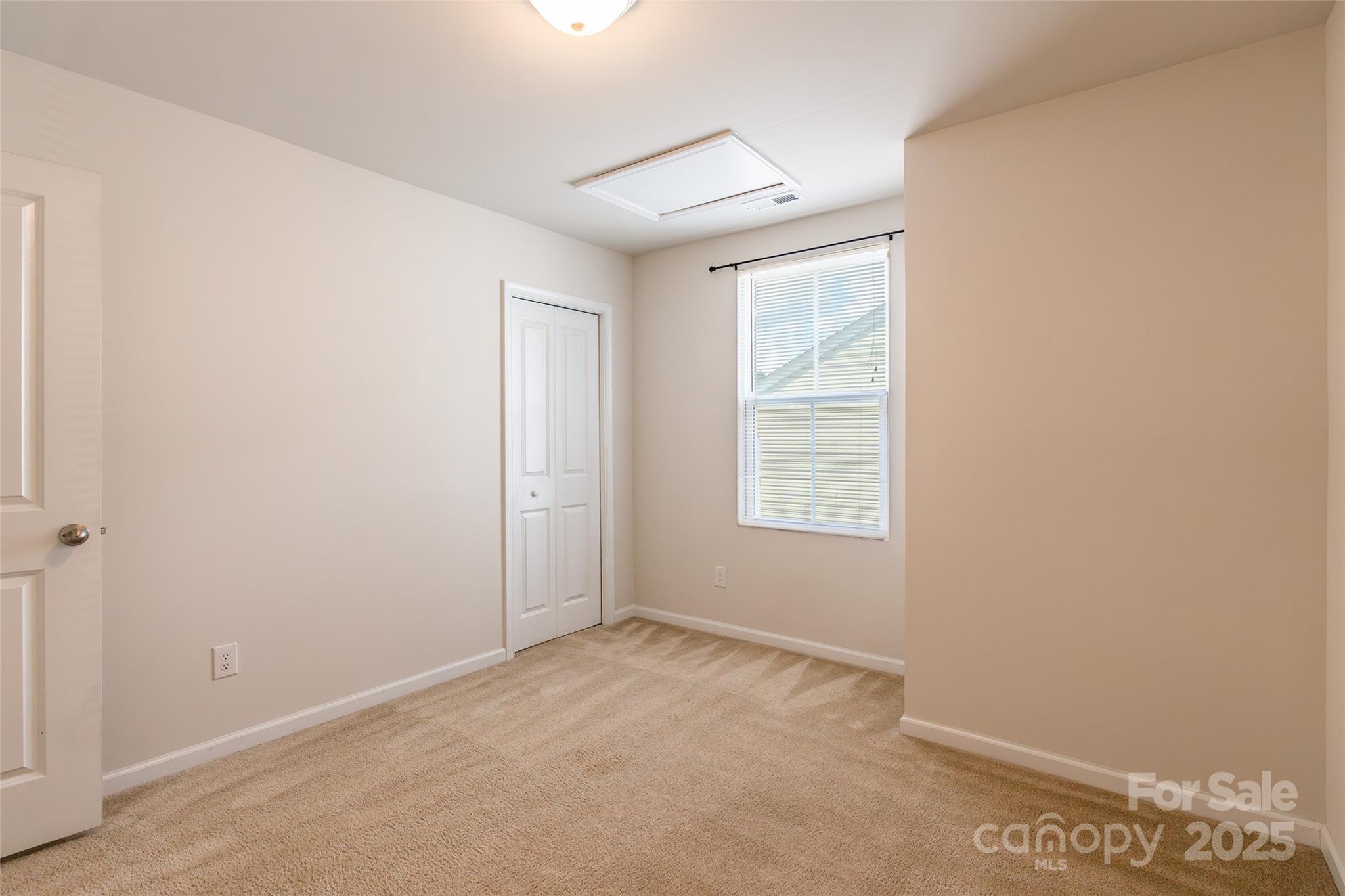 1128 Tangle Ridge Drive Southeast Concord, NC 28025 - Photo 21 of 27 a view of an empty room with a window