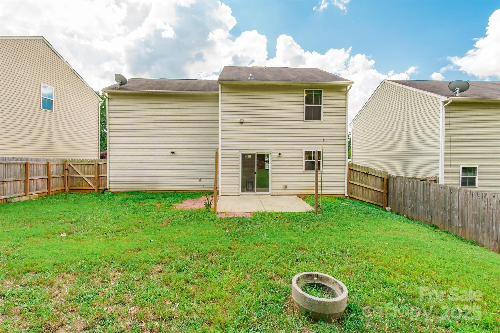 1128 Tangle Ridge Drive Southeast Concord, NC 28025 - Photo 27 of 27 a view of an house with backyard space and garden