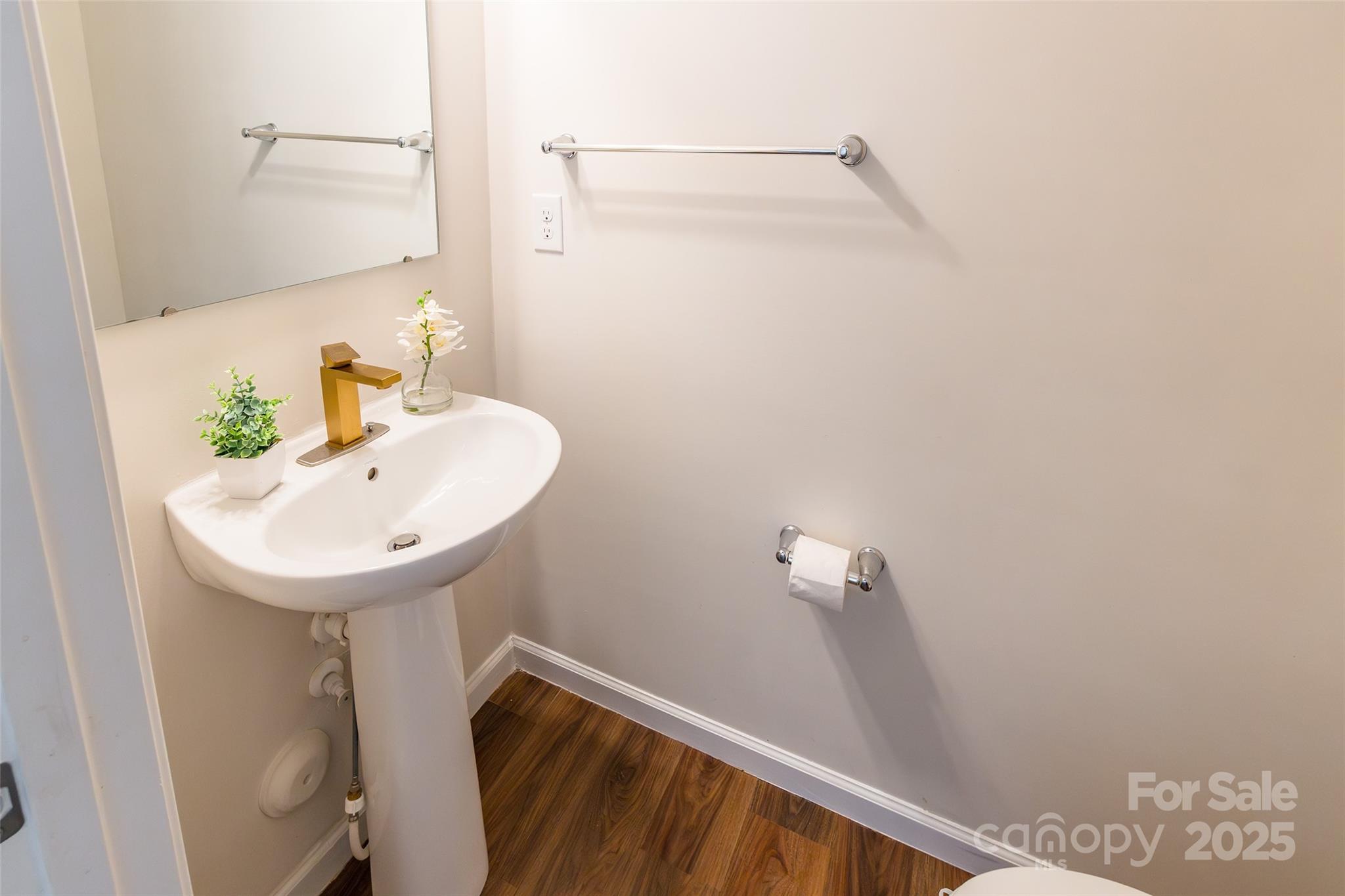 1128 Tangle Ridge Drive Southeast Concord, NC 28025 - Photo 10 of 27 a bathroom with a sink and mirror