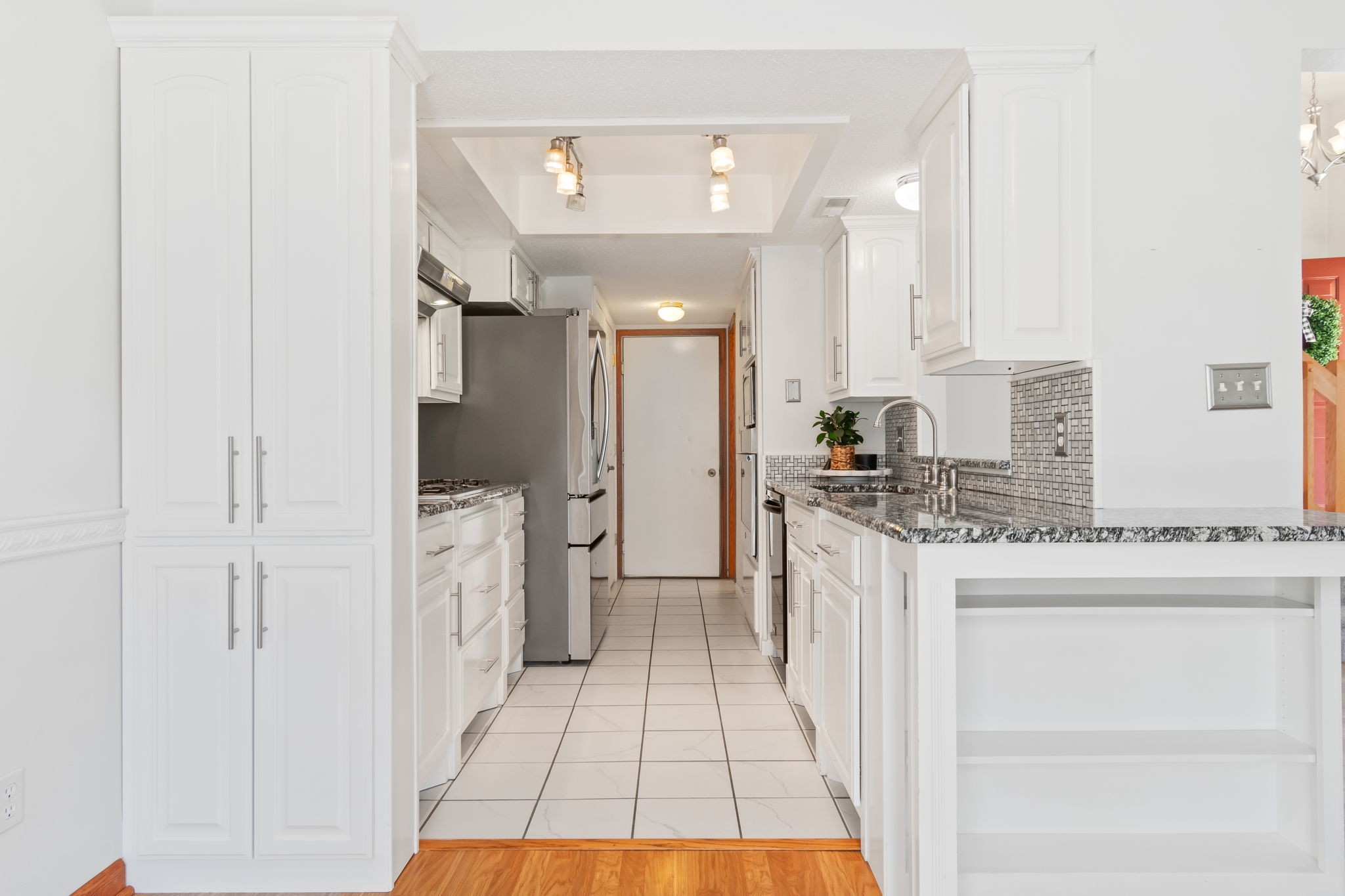 5002 Camelot Drive, Unit C Columbia, TN 38401 - Photo 14 of 46 a kitchen with a sink refrigerator and cabinets