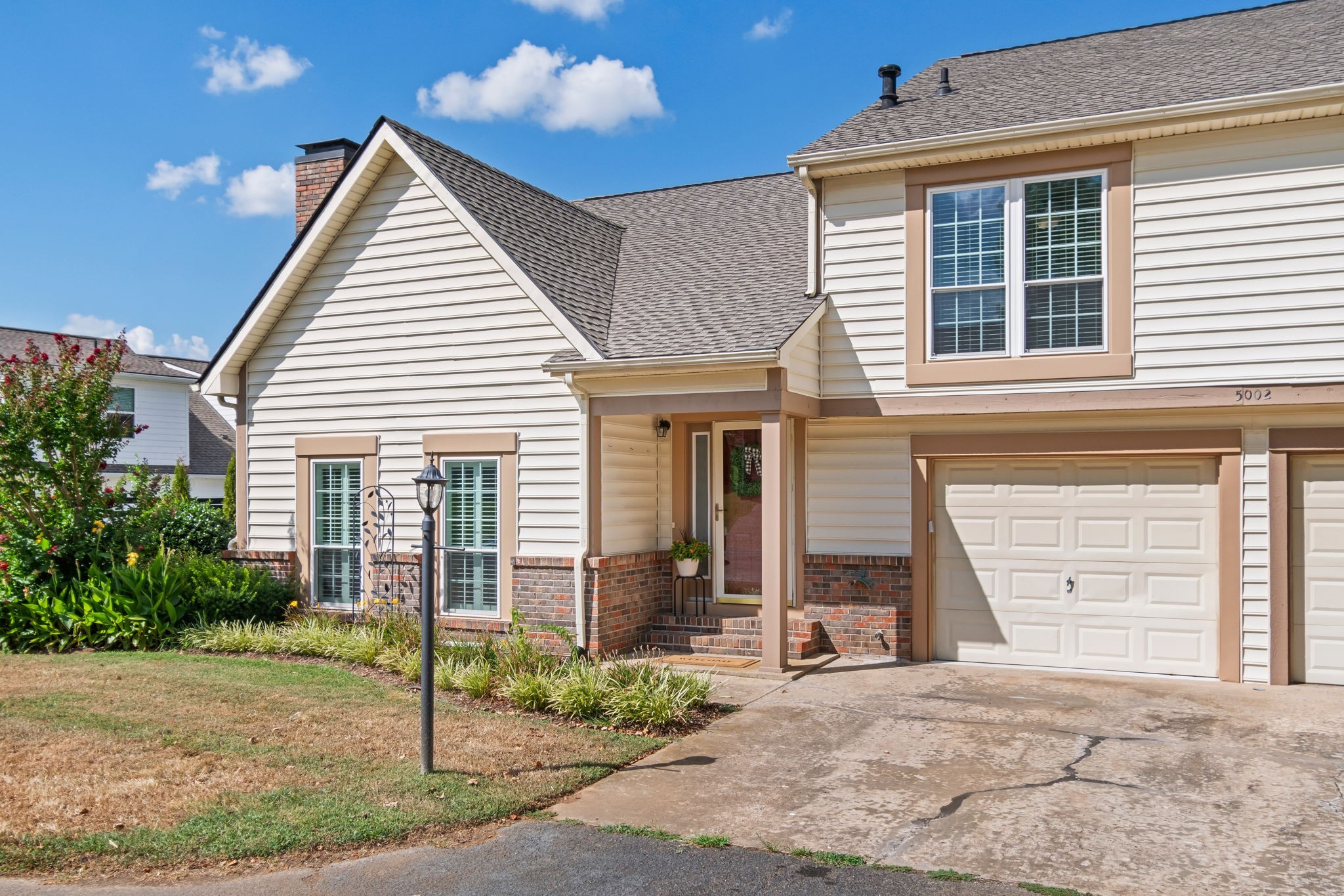 5002 Camelot Drive, Unit C Columbia, TN 38401 - Photo 2 of 46 a view of a house with small yard plants and wooden fence