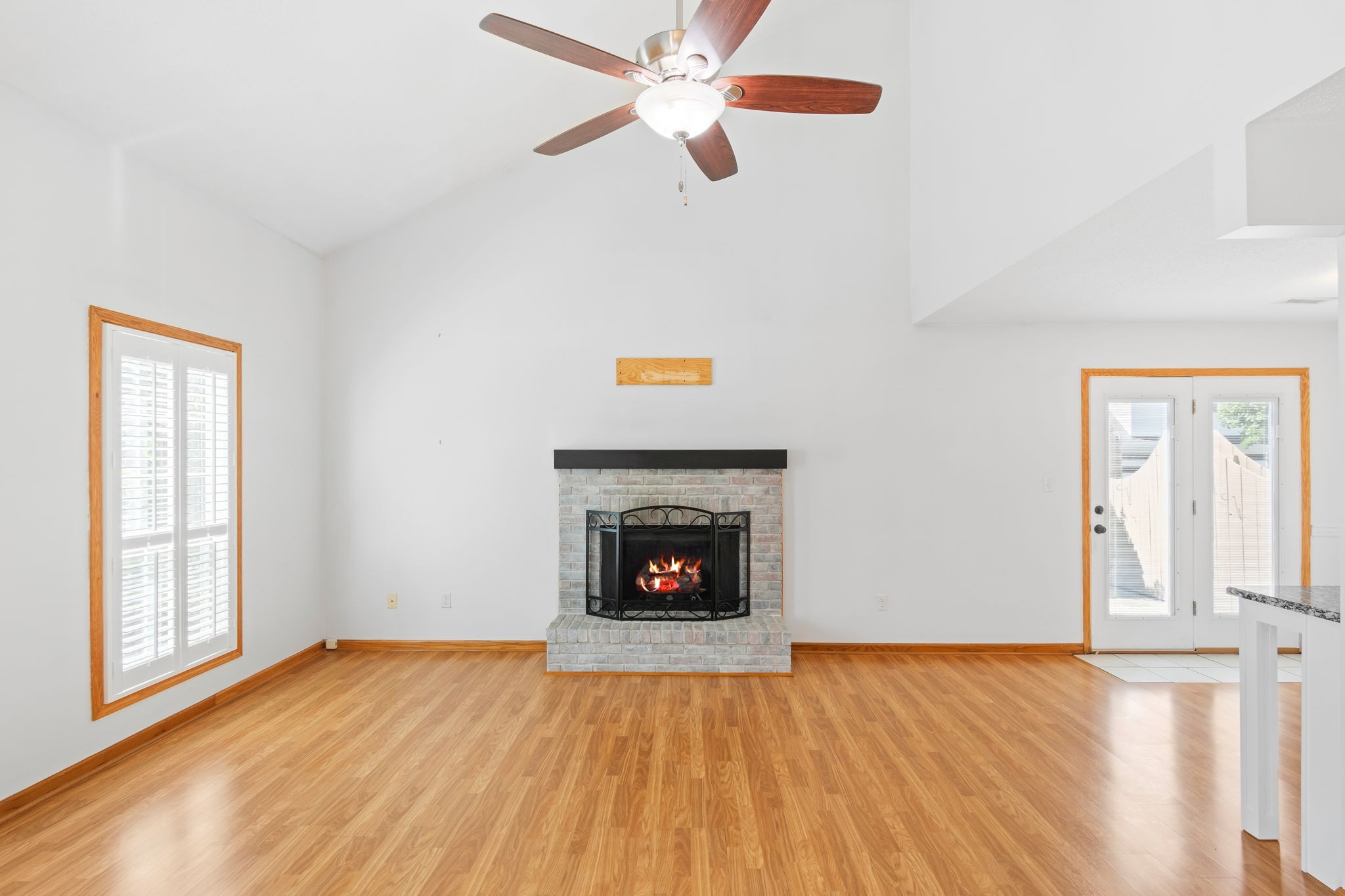 5002 Camelot Drive, Unit C Columbia, TN 38401 - Photo 24 of 46 a view of an empty room with wooden floor fireplace and a window