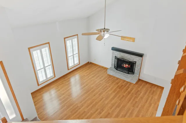 a view of kitchen with granite countertop cabinets and sink