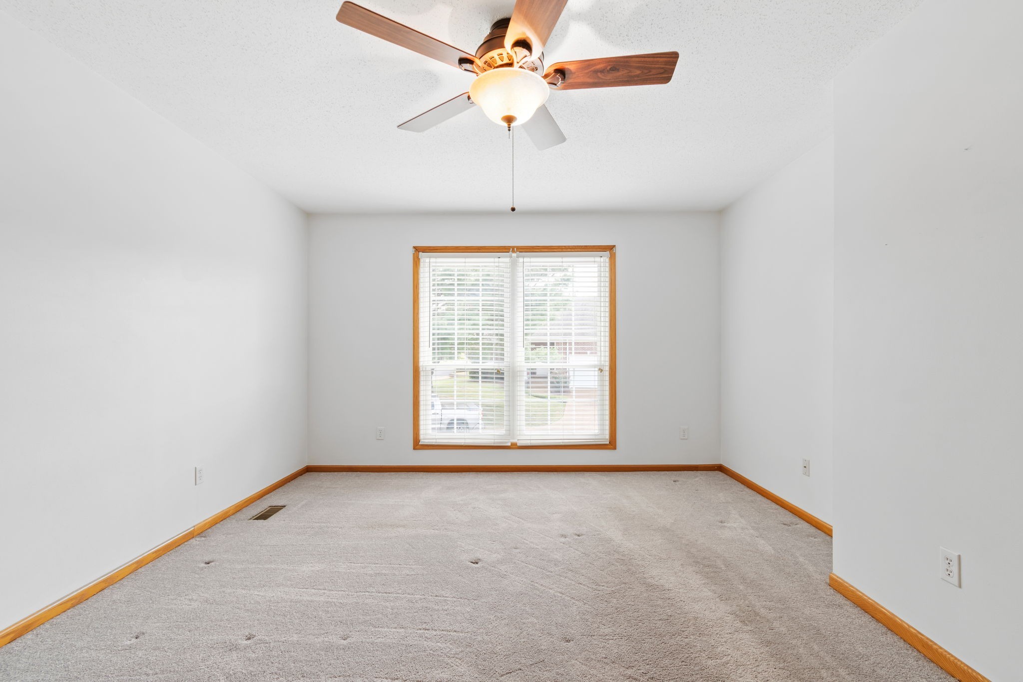 5002 Camelot Drive, Unit C Columbia, TN 38401 - Photo 31 of 46 an empty room with a window and a fan