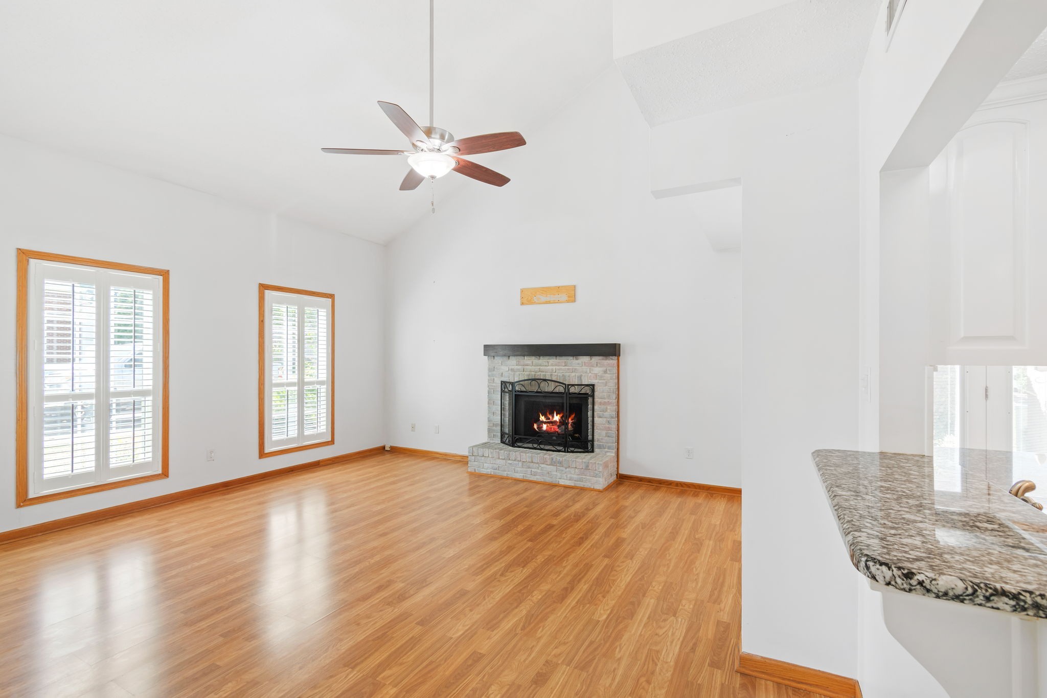 5002 Camelot Drive, Unit C Columbia, TN 38401 - Photo 7 of 46 a view of an empty room with window and wooden floor
