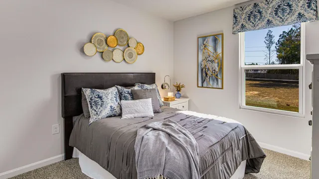 a bedroom with a bed and a dresser