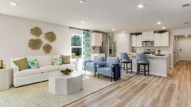 a dining room with furniture and wooden floor