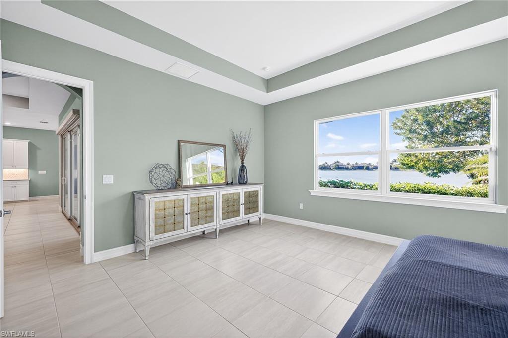 14523 Kelson Circle Naples, FL 34114 - Photo 16 of 50 a view of workspace with window and cabinet in a room