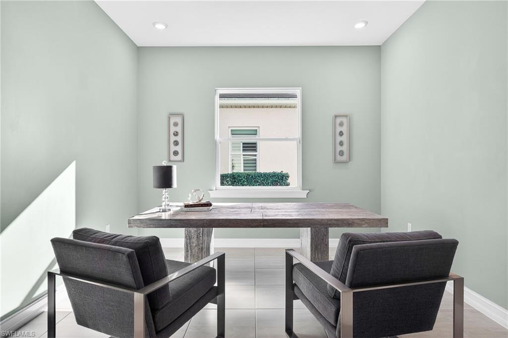 14523 Kelson Circle Naples, FL 34114 - Photo 22 of 50 a dining room with furniture and window