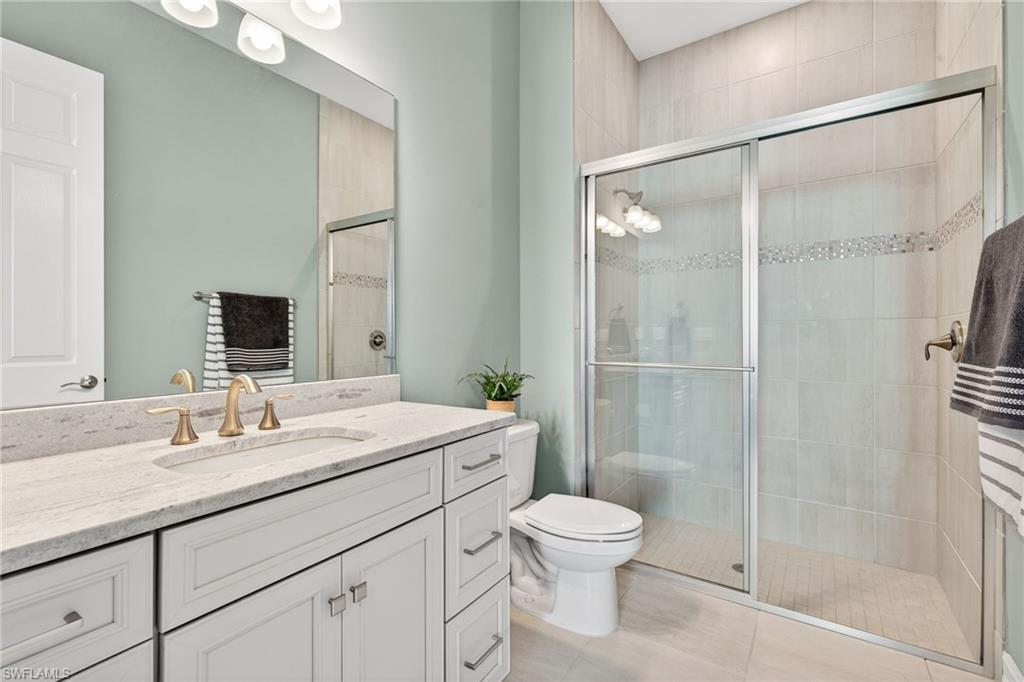 14523 Kelson Circle Naples, FL 34114 - Photo 24 of 50 a bathroom with a sink toilet and shower