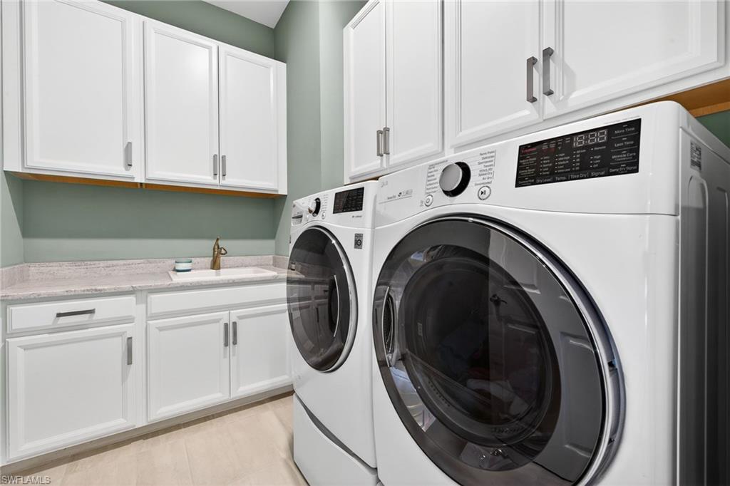 14523 Kelson Circle Naples, FL 34114 - Photo 25 of 50 a utility room with dryer and washer