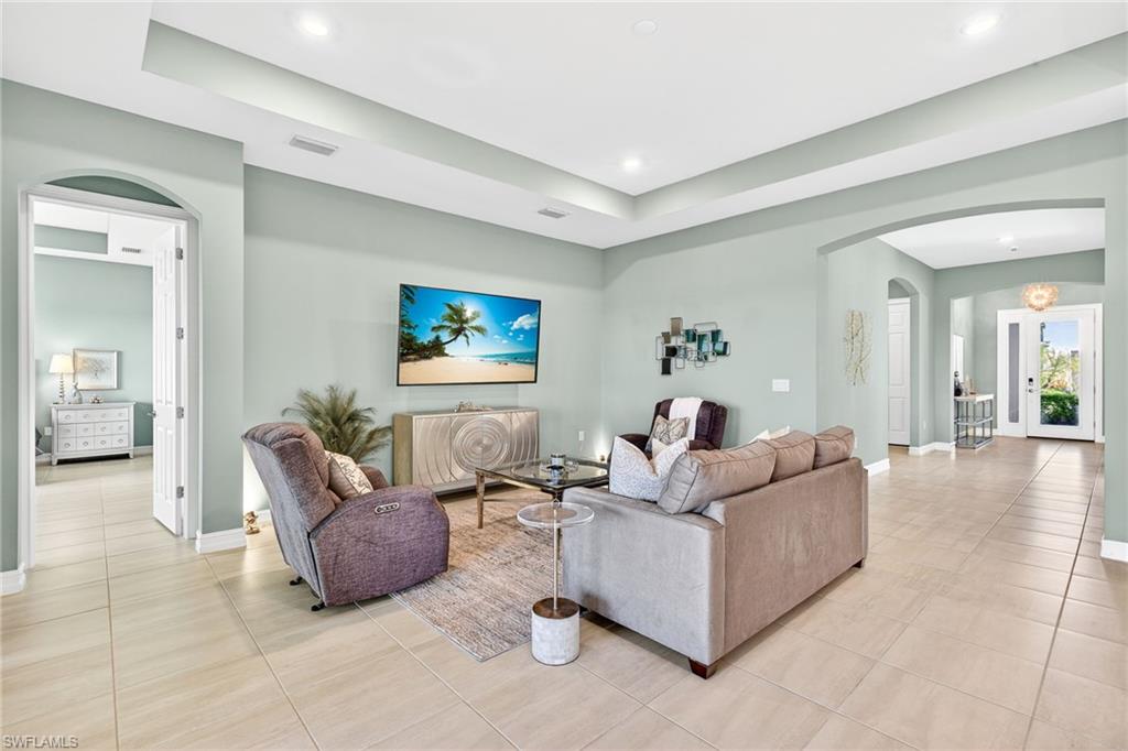 14523 Kelson Circle Naples, FL 34114 - Photo 3 of 50 a living room with furniture and a couch