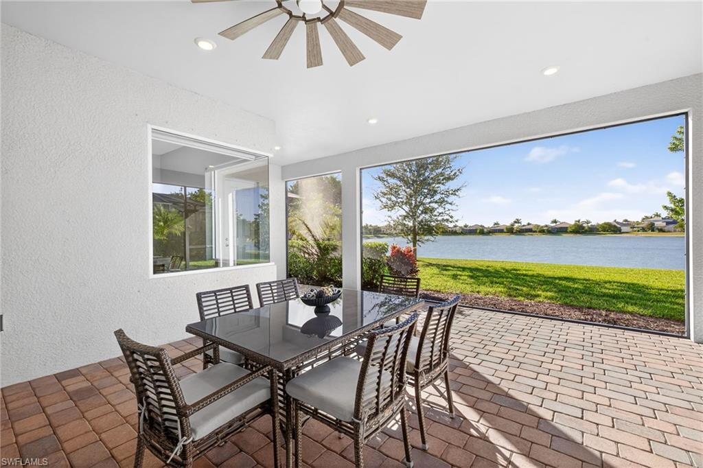 14523 Kelson Circle Naples, FL 34114 - Photo 32 of 50 a view of a patio with furniture and a backyard