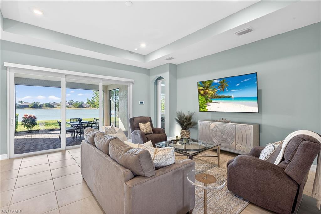 14523 Kelson Circle Naples, FL 34114 - Photo 4 of 50 a living room with furniture and a large window