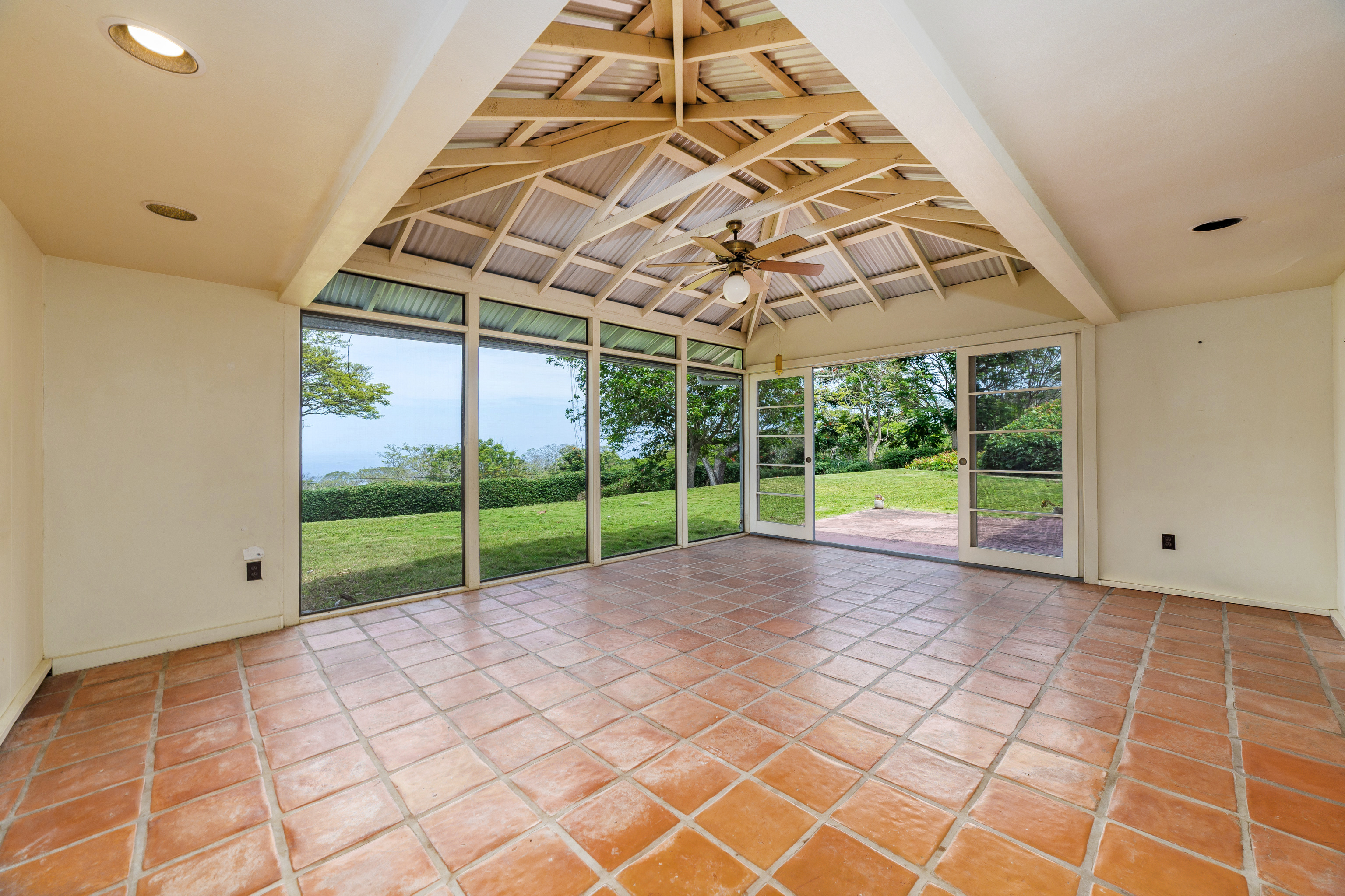 86-4190 Hookena Beach Road Captain Cook, HI 96704 - Photo 6 of 30 a view of a room with lots of windows