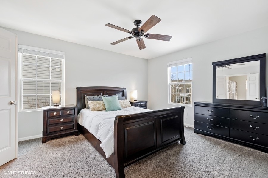 1825 Powers Road Woodstock, IL 60098 - Photo 8 of 18 a bedroom with a bed and a window