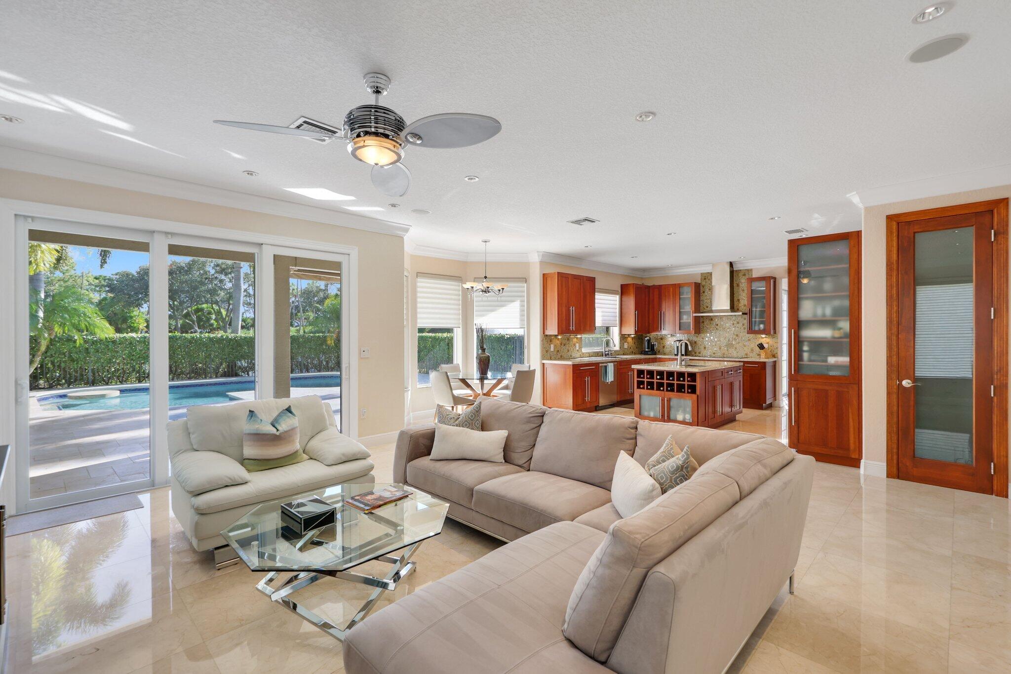 19245 Skyridge Circle Boca Raton, FL 33498 - Photo 22 of 70 a living room with furniture and a large window