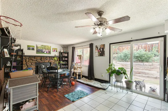 a dining room with furniture and wooden floor