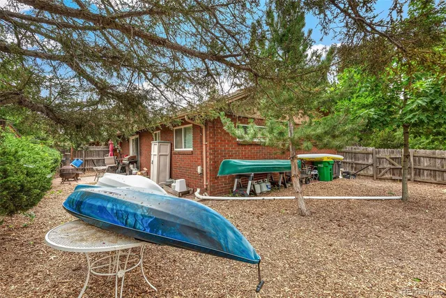 a swimming pool with outdoor seating and yard