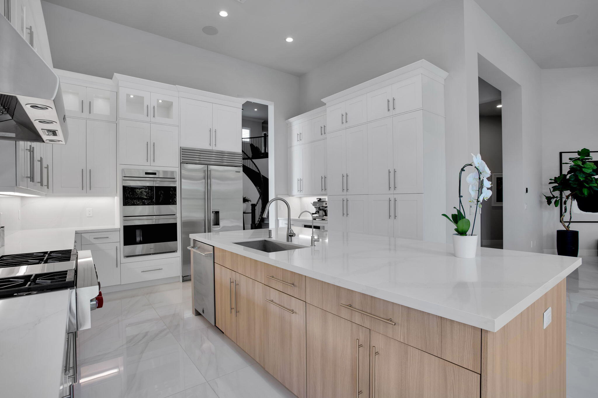 6903 Northwest 28th Avenue Boca Raton, FL 33496 - Photo 14 of 69 a kitchen with stainless steel appliances a sink stove and cabinets
