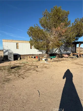 a view of pool with a yard