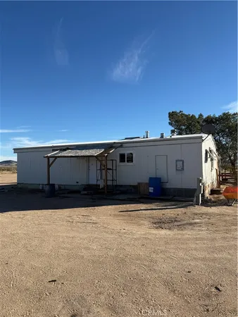 a view of a house with a big yard