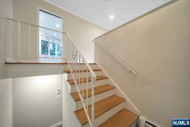 32 Rock Road Englewood Cliffs, NJ 07632 - Photo 23 of 30 a view of entryway with wooden floor and front door
