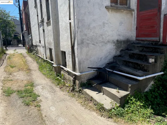 a view of a backyard with chairs