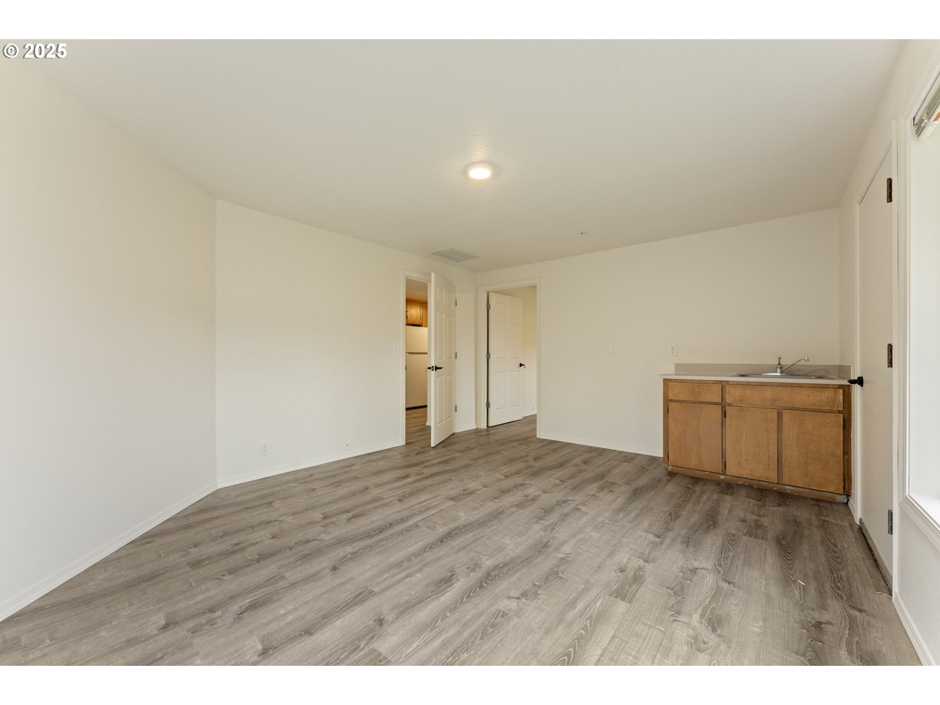1530 Southeast 5th Street Gresham, OR 97080 - Photo 11 of 39 a view of empty room with wooden floor