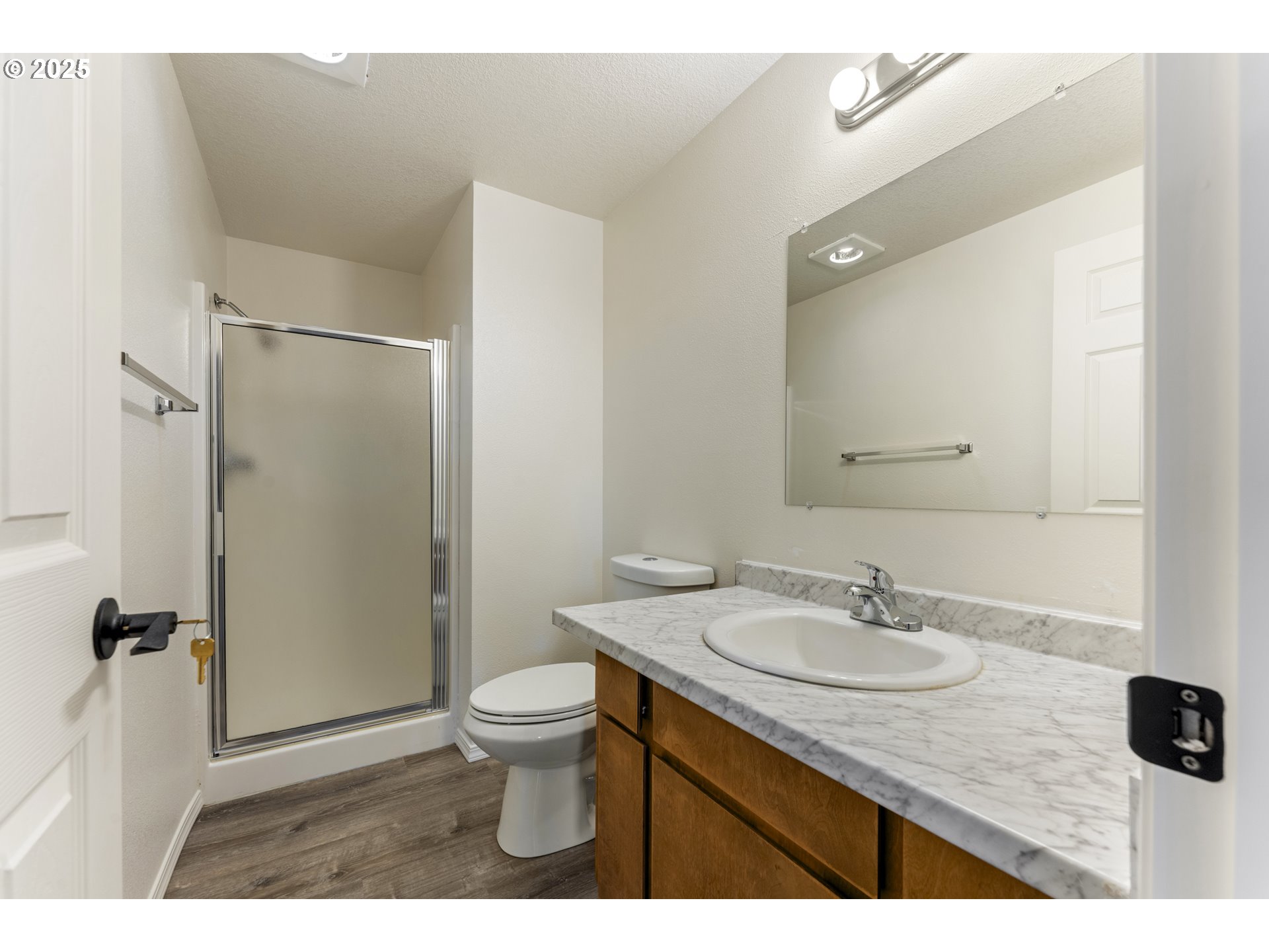 1530 Southeast 5th Street Gresham, OR 97080 - Photo 14 of 39 a bathroom with a sink a toilet a mirror and shower