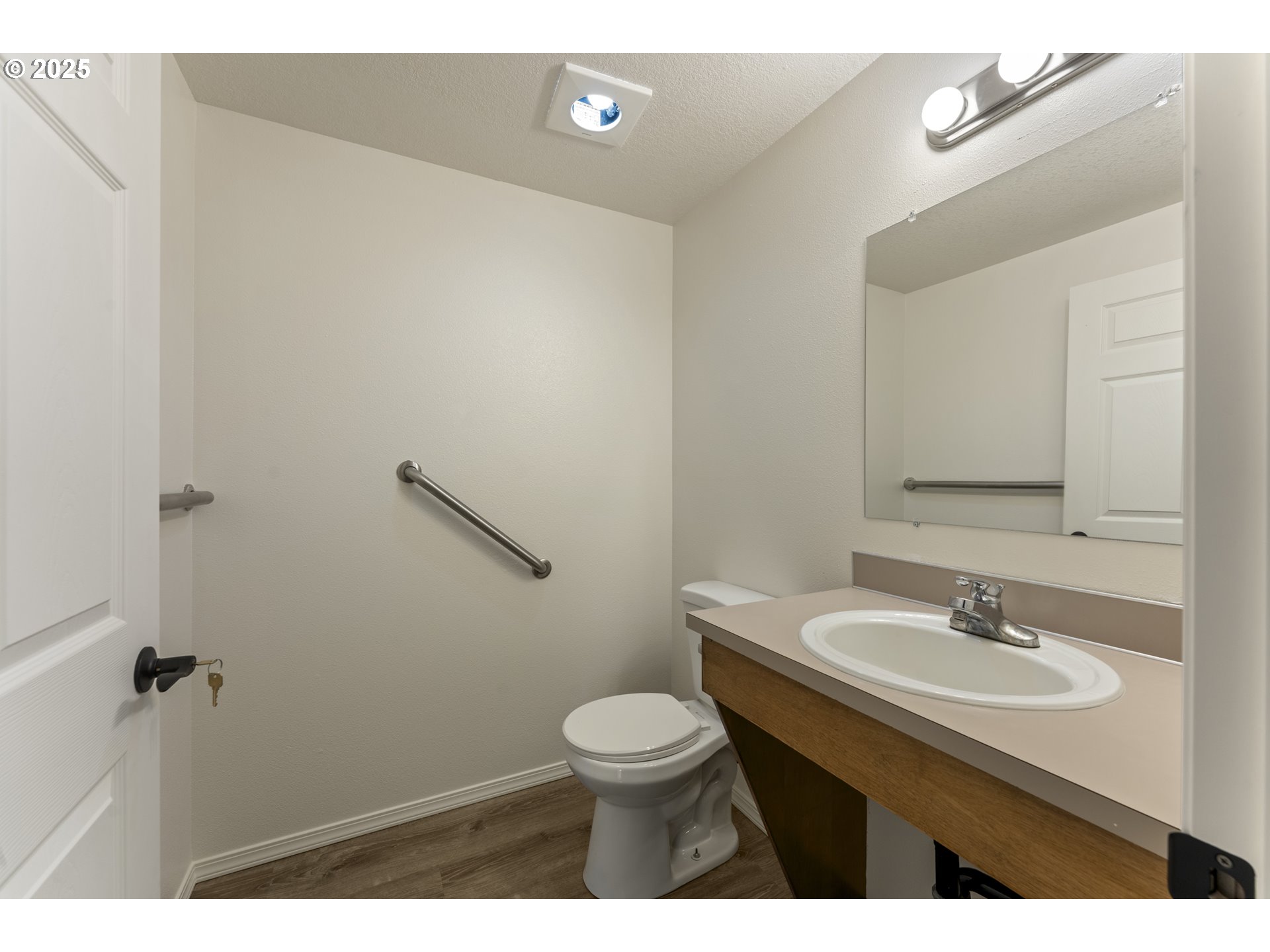 1530 Southeast 5th Street Gresham, OR 97080 - Photo 16 of 39 a bathroom with a sink a toilet and a mirror
