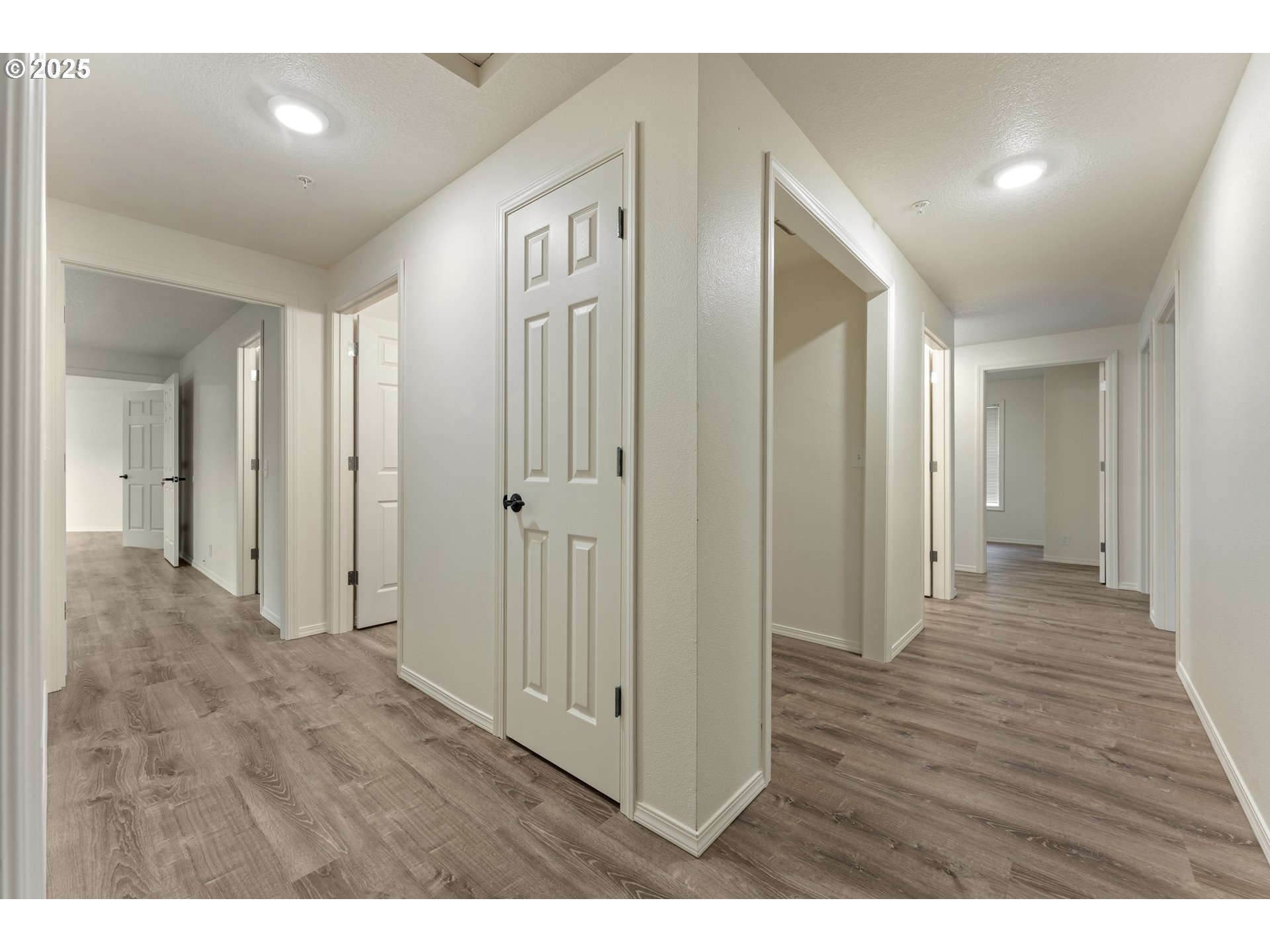 1530 Southeast 5th Street Gresham, OR 97080 - Photo 17 of 39 a view of a hallway with wooden floor